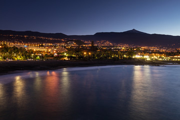 Fototapeta na wymiar Scenic sunset view of Punta Brava down Playa Maria Jimenez beach with Pico del Teide volcano in the background, the highest point above sea level in the Canary Islands