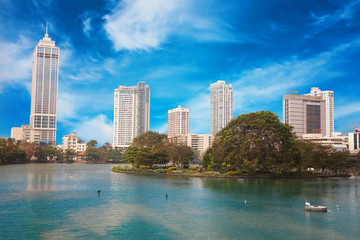 Fototapeta na wymiar Colombo, Sri Lanka - 11 February 2017: Panorama of Beira Lake and business towers skyscrapers in Colombo, Sri Lanka