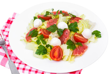 Vegetarian salad from cabbage, tomatoes and grapefruit