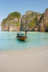 Obraz na płótnie Canvas Longtail boat anchored at Maya Bay on Phi Phi Leh Island, Krabi Province, Thailand