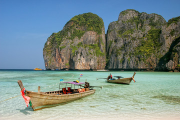 Obraz na płótnie Canvas Longtail boat anchored at Maya Bay on Phi Phi Leh Island, Krabi Province, Thailand