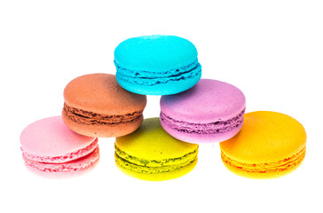 Delicate delightful delicious colored macaroons on white background