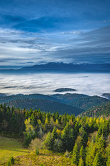 Misty sunrise landscape from Luban peak in Gorce mountains, Poland