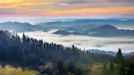 Naklejka na ściany i meble Misty sunrise landscape from Luban peak in Gorce mountains, Poland