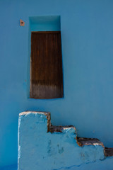 Door. Old wooden door. Juzcar village, Malaga province. Costa del Sol, Andalusia, Spain.