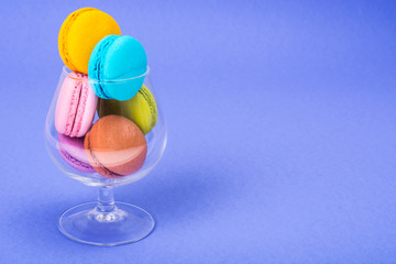 Delicate delightful delicious colored macaroons on white background