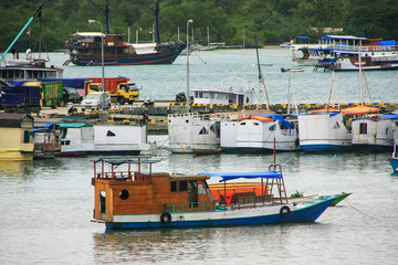 Boats anchored at Labuan Bajo town  on Flores Island, Nusa Tenggara, Indonesia © donyanedomam