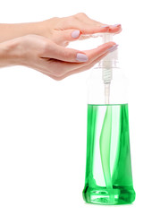 Dishwashing detergent bottle in female hand