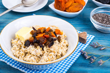 Porridge of oatmeal with dried fruits and chia seeds