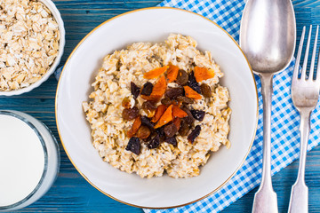 Porridge of oatmeal with dried fruits and chia seeds