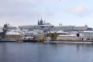 Christmas snowy Prague Lesser Town with gothic Castle, Czech republic