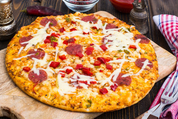 Delicious homemade pizza with salami