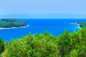 Fototapeta na wymiar Wonderful romantic summer afternoon landscape panorama coastline Adriatic sea. Boats and yachts in harbor at magical clear transparent turquoise water. Cres island. Croatia. Europe.