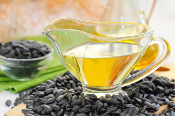 Sunflower oil in glass and sunflower seeds