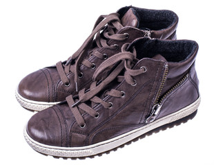 Brown women's boots with laces on white soles