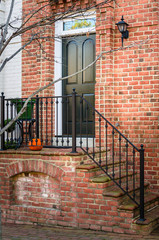 Black Wooden Front Door of an Old Brick House in old Town Alexandria, VA.
