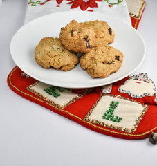Christmas scene with golden brown chocolate chip cookies on a plate for Santa Claus for Santa Claus