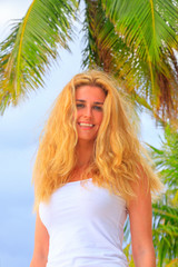 Blonde beauty woman at the beach on Maldives