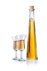 Glas and bottle of liqueur, isolated 