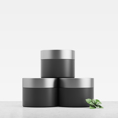 Black cream jars, white background