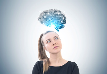 Pensive woman with a ponytail, brainstorming