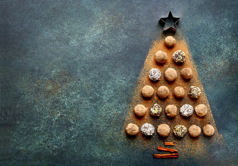 Abstract christmas tree made from chocolate truffles.Top view with copy space.