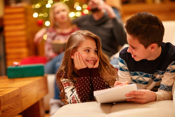 child's lying and writes letter to Santa Claus for Christmas .