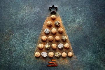 Abstract christmas tree made from chocolate truffles.Top view with copy space.