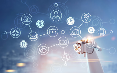 Network in a blue city, robot hand