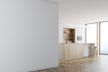 White kitchen, wooden bar stand, wall