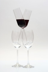 four glasses of wine on a light background
