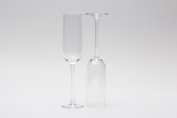 two empty wine glass on a light background.