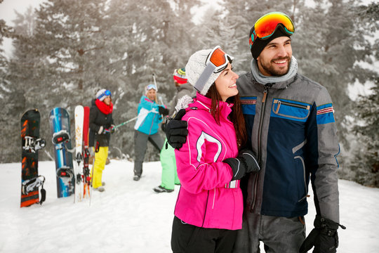 couple snowboarder enjoying at ski resort in the mountain with friends