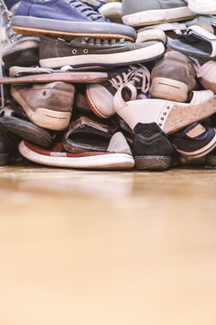 A bunch of your favorite variety of shoes lying on the floor.