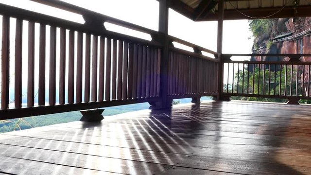 A wooden balcony with light in the morning. Quiet, suitable for relaxing. Video