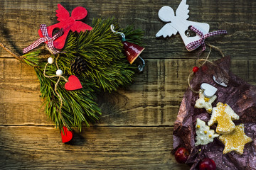Christmas fir tree with decoration on dark wooden board