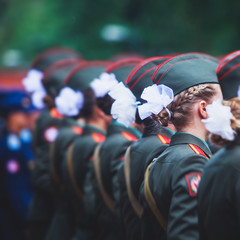 A formation line of female military students with in green uniform, line up during the taking the oath of allegiance ceremony