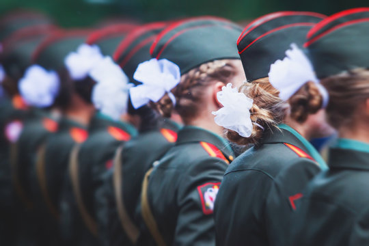 A formation line of female military students with in green uniform, line up during the taking the oath of allegiance ceremony