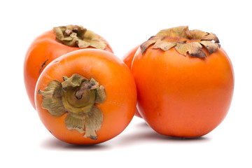 Persimmon fruits on white