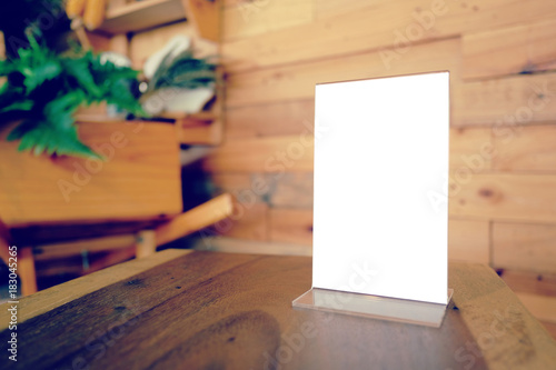 Mock Up Menu Frame Standing On Wood Table In Bar Restaurant Cafe
