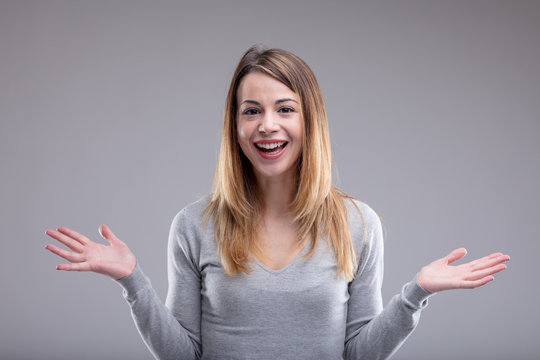smiling woman showing open hands