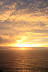 Naklejka na ściany i meble Sunset in pacific ocean, near CA route 1