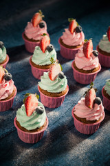Cupcakes on wooden background