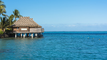 On piles bungalows on the lagoon, luxury resort, French Polynesia 
