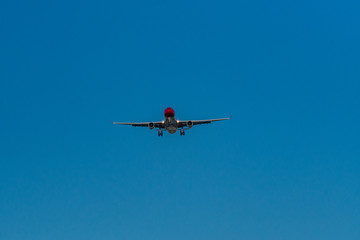 red head air plane ready to land