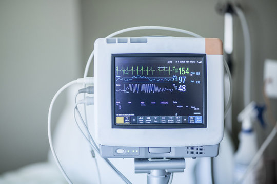Medical vital signs monitor instrument in a hospital. This health care device displays and monitors heart rate and oxygen levels in hospital patients