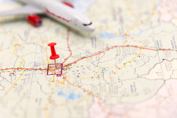 Travel destination points on a map near airplane. Travel Concept. select focus.