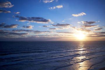 Fototapeta na wymiar Tropical marine sunset over a calm ocean