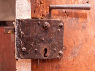 Fototapeta na wymiar Old Door Lock in a European Farm House