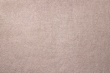 Fototapeta na wymiar Beige natural cotton knitted fabric background or texture